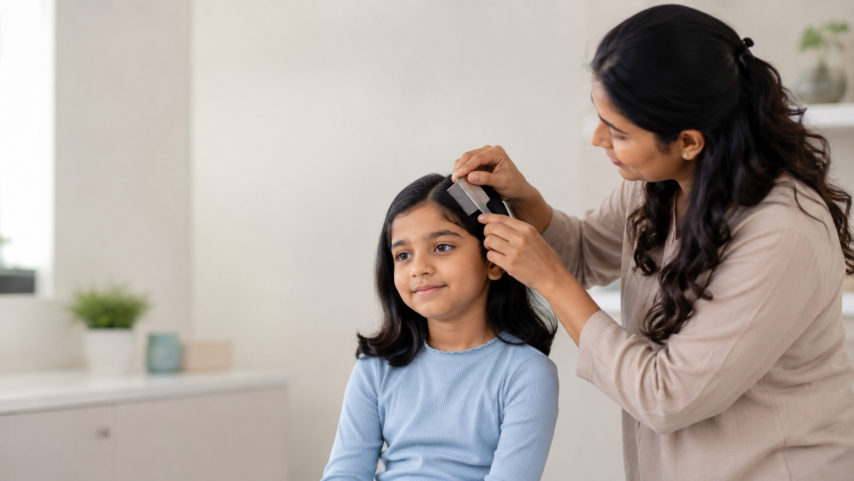 Indian parent carefully combing a child hair to check for head lice